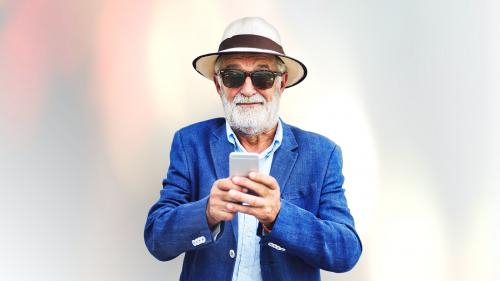 Elderly man using a mobile phone - 894645