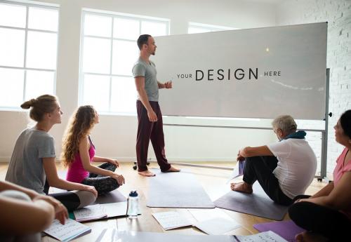 Yoga instructor using a board mockup for instructions in the classroom - 894801