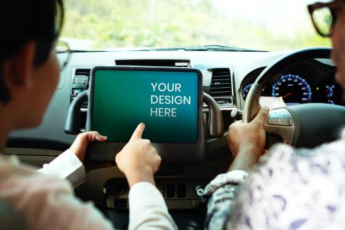 Couple in a car finding direction on a tablet mockup - 894815