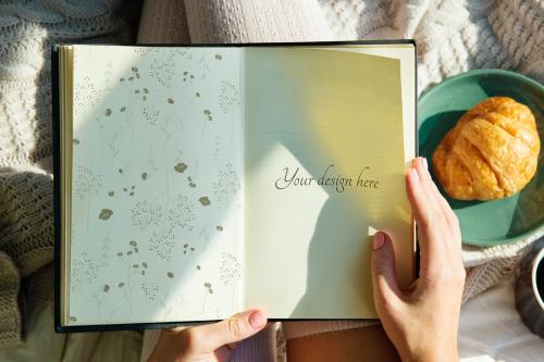 Woman reading a novel mockup in the morning with bread - 894829