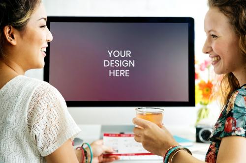 Cheerful friends using a computer screen mockup - 894868