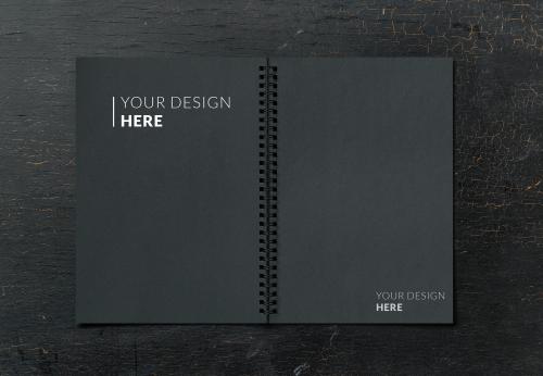 Black notebook mockup on a black table - 894870
