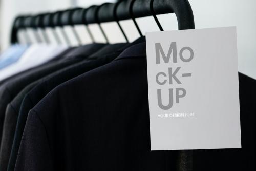 Clothing rack with a sign mockup - 894871