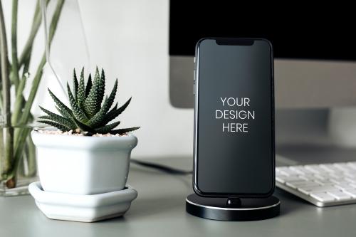 Phone mockup on a charging dock - 894909