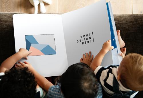 Toddlers reading a book mockup - 666148