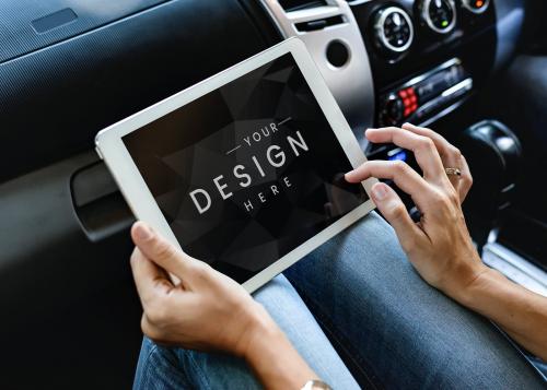 Woman using a digital tablet screen mockup in a car - 666167