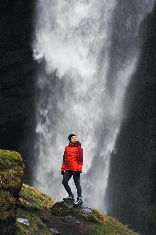 Female hiker with a view of Kvernufoss waterfall in South Iceland - 2042620