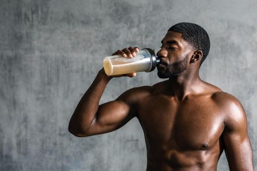 Black man drinking energy drink - 2108999