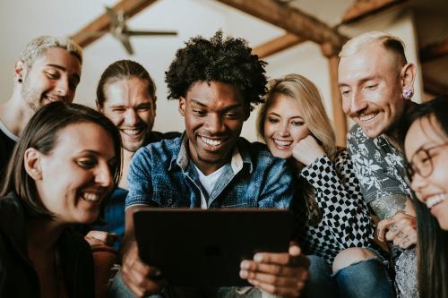 Diverse people using a digital tablet together - 2204699