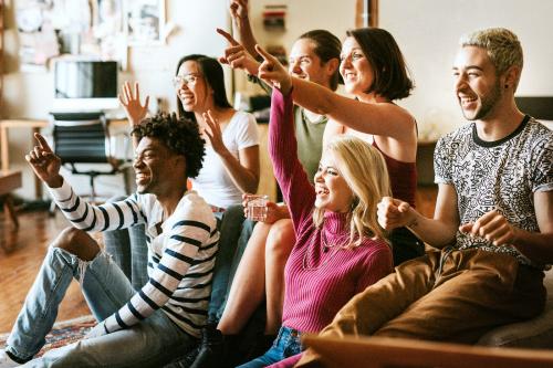 Friends watching a game show on the tv - 2204703