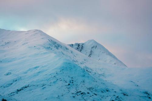 Snowy mountain top on a cloudy day - 2221678