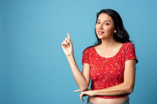 Cheerful Asian woman isolated on blue background - 2252413