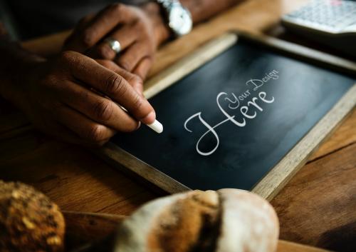 Man writing on a blackboard mockup - 844028