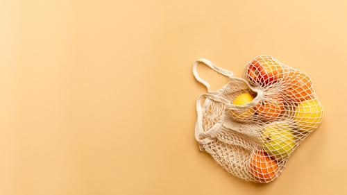 Reusable net bag with fruits on an orange background - 2274574