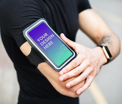 Active man with a phone mockup in an armband - 580843