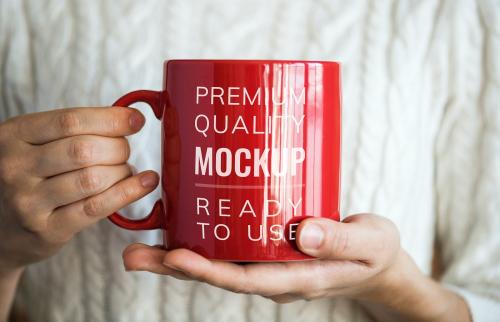 Hands holding a red mug mockup - 580884