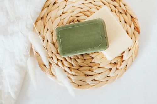 Flat lay natural handmade soap bars with grass flowers in spa compostition - 2281971