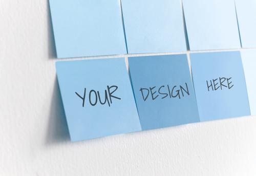 Blue sticky note mockups on a white wall - 580896