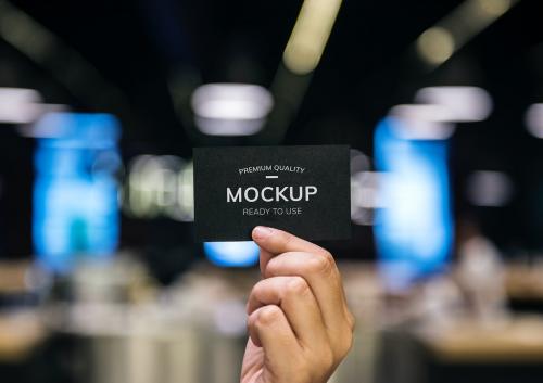 Hand holding a black card mockup - 580923