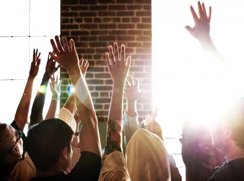 People raising their hands in a seminar - 2027398