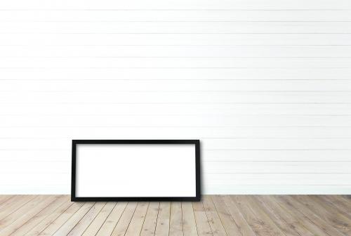 Frame mockup against a white wall - 586100