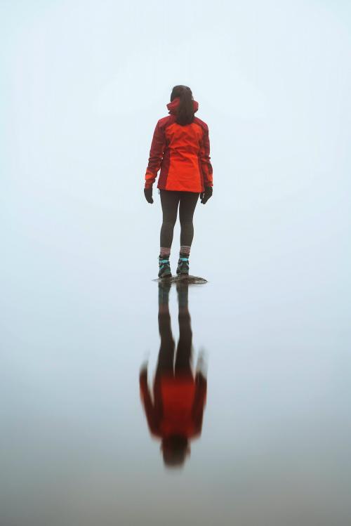 Woman standing on a rock at Red Tarn lake in the English Lake District, UK - 2097891