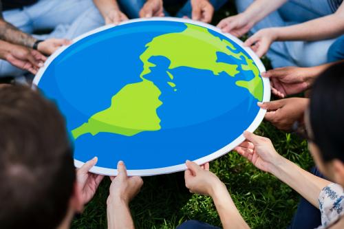 Group of people holding an earth board in the park - 537875