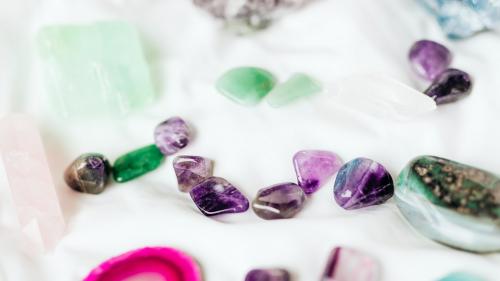 Colorful healing crystals on a blanket - 2282156