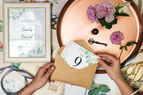 Hand holding a wedding table card - 545556