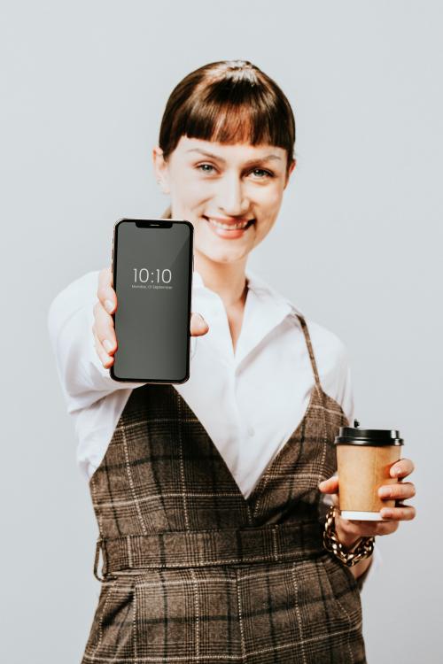 Happy woman holding a mobile phone - 2020103