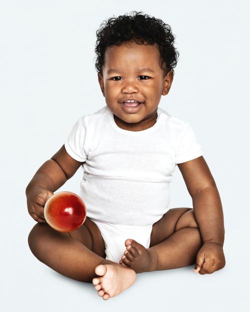 Baby sitting on the floor in a studio - 546303