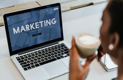 Woman sipping a cup of coffee while working - 561071