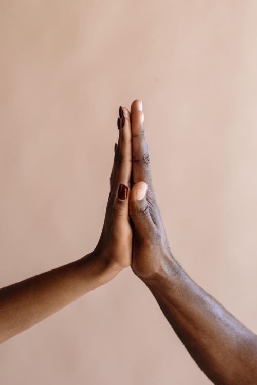 High five gesture on beige background - 2025293