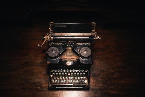 Old typewriter on a wooden table - 2042569