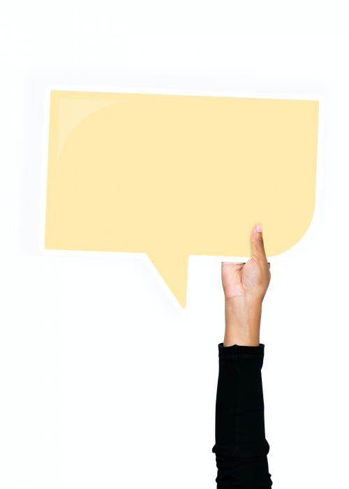 Hand holding a speech bubble cardboard prop - 526336