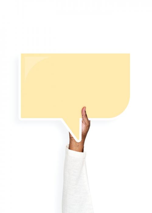 Hand holding a speech bubble cardboard prop - 526354