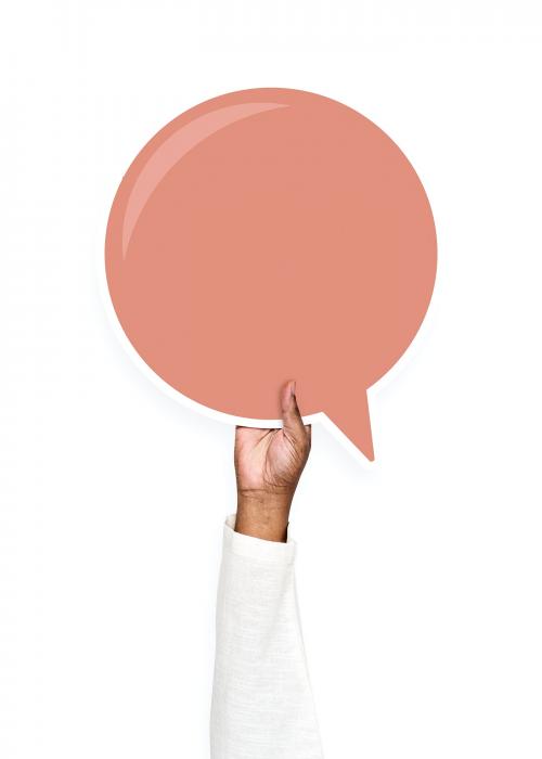 Hand holding a speech bubble cardboard prop - 526459