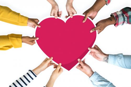 Diverse hands holding a red heart - 526468