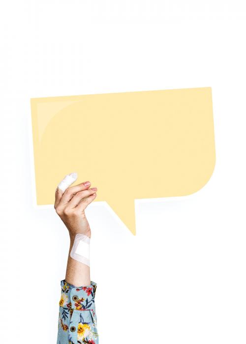 Hand holding a speech bubble cardboard prop - 526485