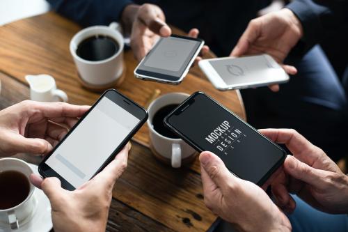 Business people using smartphones in a cafe - 534237