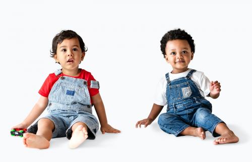 Two little boys sitting on the floor - 536023