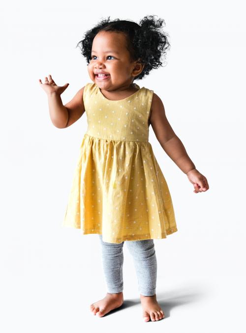 Happy little girl in a yellow dress - 536027