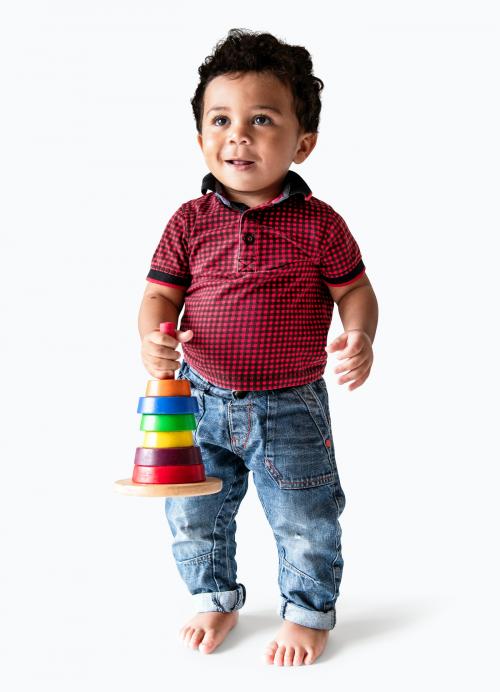 Happy boy holding a stack of colorful discs - 536028