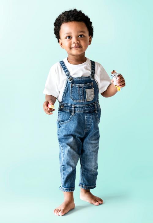 Happy young boy holding a protein bar - 536031