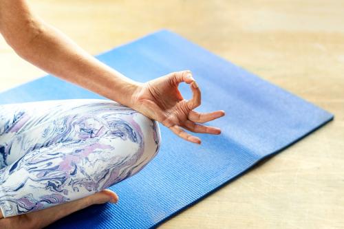 Fitness woman in a Sukhasana pose - 2194497