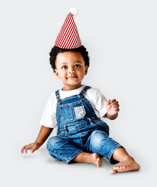 Cute little boy in dungarees with a Christmas hat - 536048