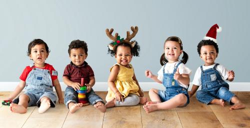 Cute diverse toddlers sitting together on the floor - 536052