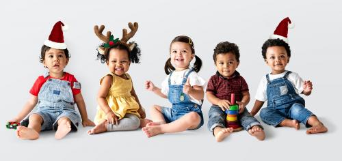 Cute diverse toddlers sitting together on the floor - 536057