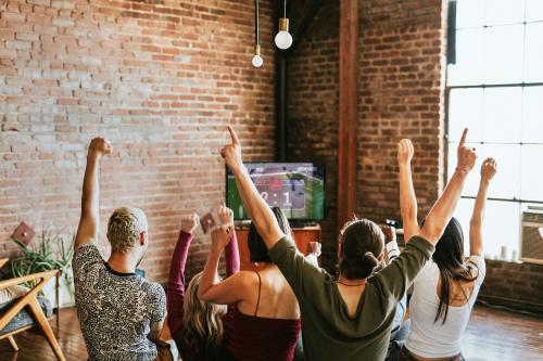 Friends watching a game show on the tv - 2206492