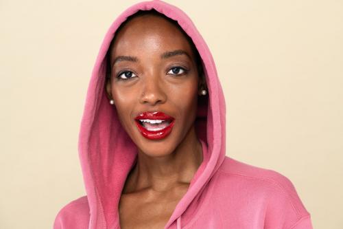 Black woman in a pink hoodie - 2254169